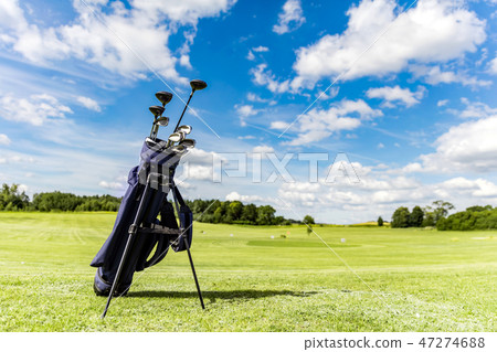 Golf equipment bag standing on a course. Golf equipment bag standing on a course. 47274688