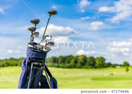 Golf equipment bag standing on a course. 47274696