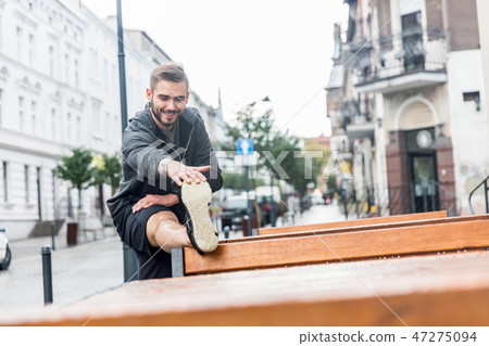 Flexing muscles after workout. 47275094