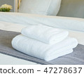 White towels on bed in modern bedroom interior 47278637