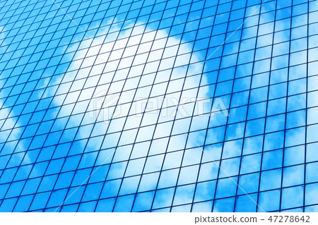glass window of modern skyscraper with clouds 47278642
