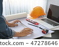 architect working on table with blueprint and tool 47278646