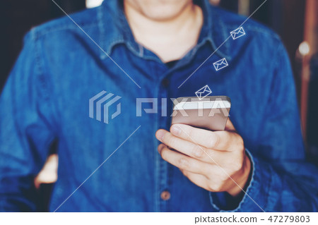 Businessman using mobile online icon social  47279803