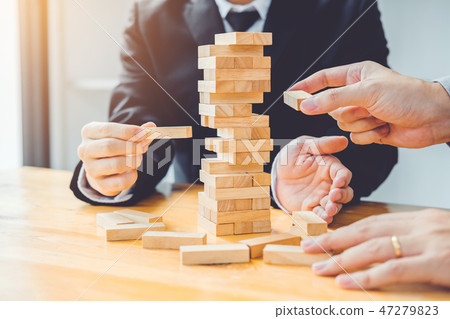 Businessman plan and strategy in business Domino 47279823