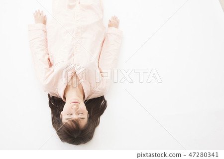 A young woman sleeping A young woman sleeping 47280341
