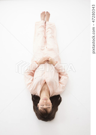 A young woman sleeping A young woman sleeping 47280343