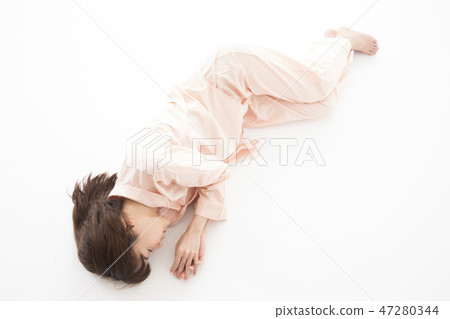 A young woman sleeping A young woman sleeping 47280344