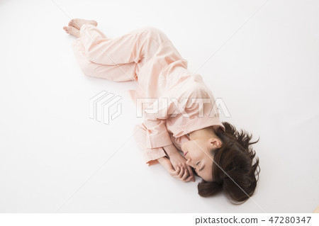 A young woman sleeping A young woman sleeping 47280347