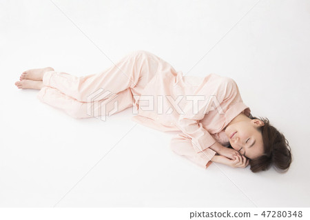 A young woman sleeping A young woman sleeping 47280348