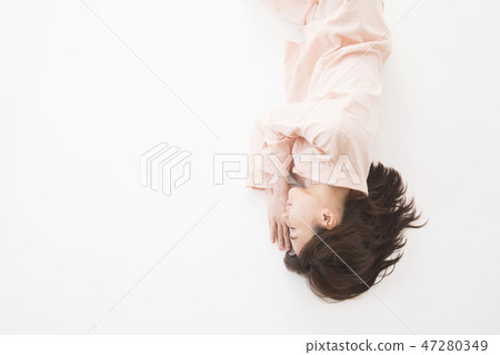 A young woman sleeping A young woman sleeping 47280349