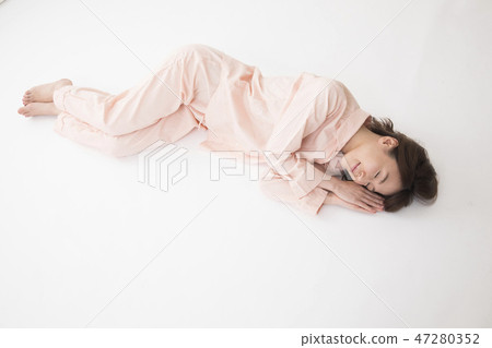 A young woman sleeping A young woman sleeping 47280352
