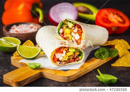 Burritos wraps with chicken, beans, corn, tomatoes Burritos wraps with chicken, beans, corn, tomatoes 47280388
