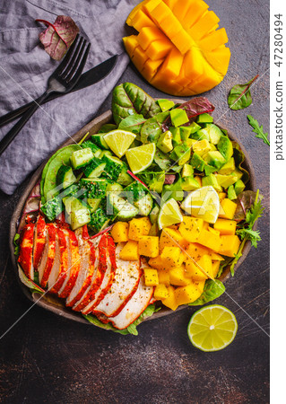 Grilled chicken, mango and avocado salad Grilled chicken, mango and avocado salad 47280494