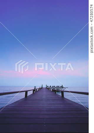 Beautiful jetty walkway on the sea twilight time. Beautiful jetty walkway on the sea twilight time. 47280574
