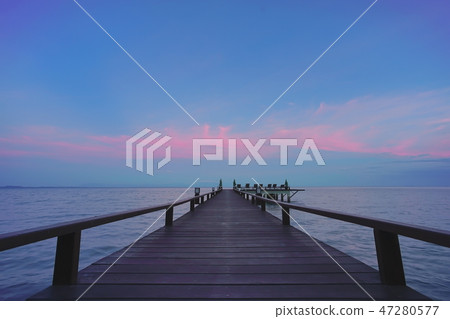 Beautiful jetty walkway on the sea twilight time. Beautiful jetty walkway on the sea twilight time. 47280577
