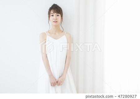 A woman by the window 47280927