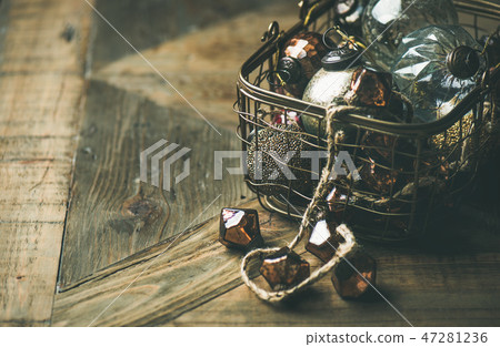 Christmas decoration balls in basket over wooden 47281236