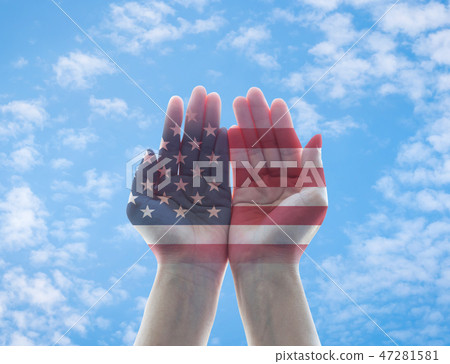 America flag pattern on woman hands with open palm America flag pattern on woman hands with open palm 47281581