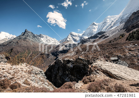 Snow mountain range in rocky valley Snow mountain range in rocky valley 47281981