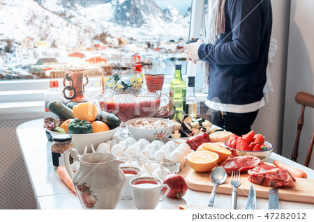 Man holding cup with sightseeing view in winter Man holding cup with sightseeing view in winter 47282012