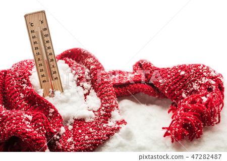 thermometer with sub zero temperature sticks out in a snowdrift wrapped red scarf thermometer with sub zero temperature sticks out in a snowdrift wrapped red scarf 47282487