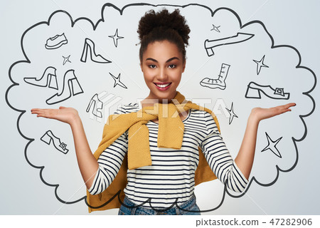 Young woman studio isolated in white hands aside presenting look 47282906