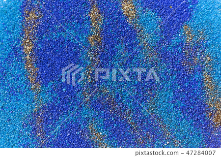 Layered colorful sand pattern. Marble style background. Blue and gold powder texture. Layered colorful sand pattern. Marble style background. Blue and gold powder texture. 47284007