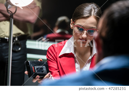 Police detective recording the statement of a suspect or witness Police detective recording the statement of a suspect or witness 47285231