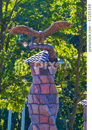 beautiful statue of a metal eagle on a stone firep 47285349