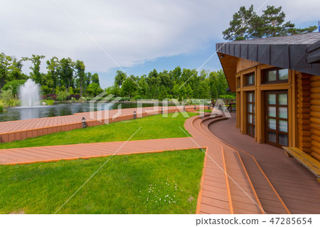 a wooden house with a spacious terrace overlooking a wooden house with a spacious terrace overlooking 47285654