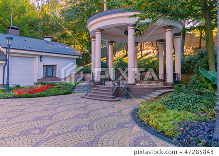 Spacious gazebo with marble floor and steps agains Spacious gazebo with marble floor and steps agains 47285843