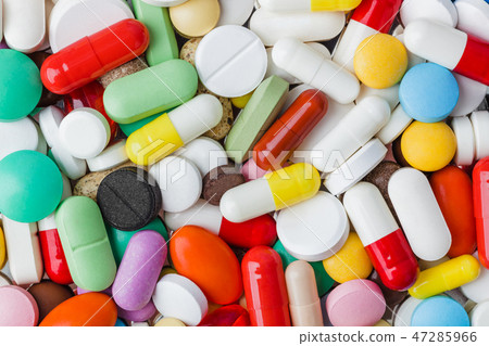 Heap of pills - medical background 47285966