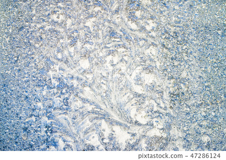 frost pattern on glass window 47286124