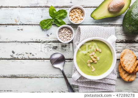 green soup in a white bowl green soup in a white bowl 47289278