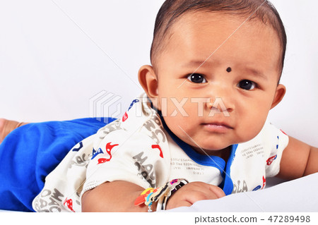 Cute baby sleeping on bed on stomach, Pune Cute baby sleeping on bed on stomach, Pune 47289498