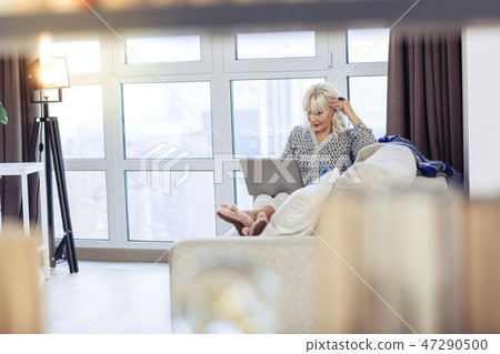 Beautiful nice woman resting in her house 47290500