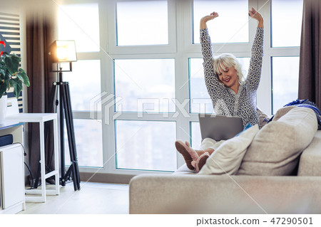 Nice joyful woman enjoying her day off at home 47290501
