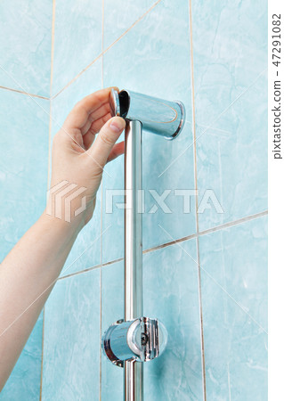 repairman closes the cover bracket shower holder repairman closes the cover bracket shower holder 47291082