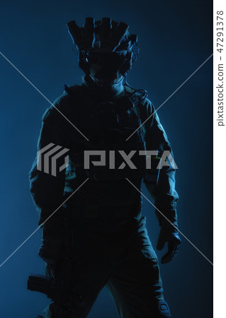 Equipped and armed soldier back view studio shoot Equipped and armed soldier back view studio shoot 47291378