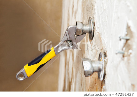 eccentric tap adjusts position, close up eccentric tap adjusts position, close up 47291427