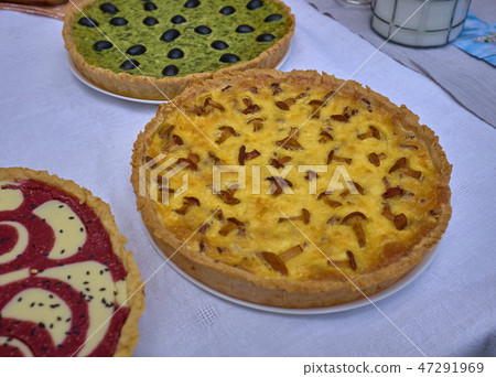 Delicious cakes with cheese and mushrooms on table 47291969