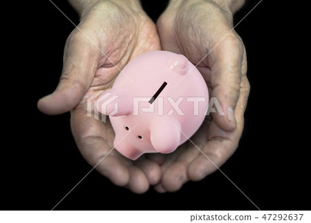 Old hands with piggy bank, pension concept Old hands with piggy bank, pension concept 47292637