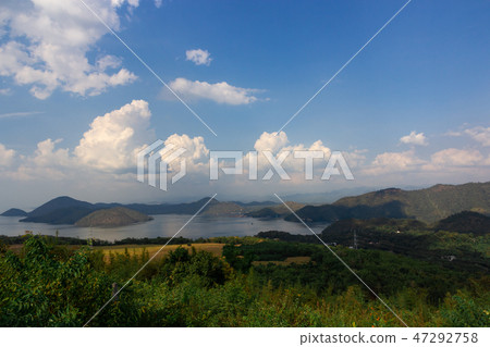 Nature scene of Srinagarind Dam with cloudy sky  47292758