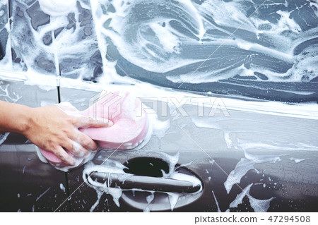people man holding hand pink sponge for washing people man holding hand pink sponge for washing 47294508