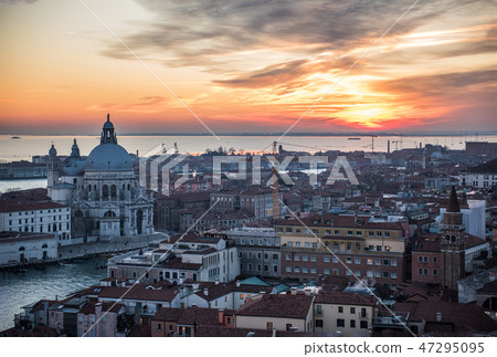 Venice Santa Maria della Salute church and street which stains in the sunset from the bell tower of St. Mark's square Venice Santa Maria della Salute church and street which stains in the sunset from the bell tower of St. Mark's square 47295095