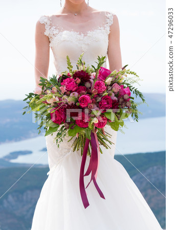 bright bouquet of various red and pink flowers 47296033