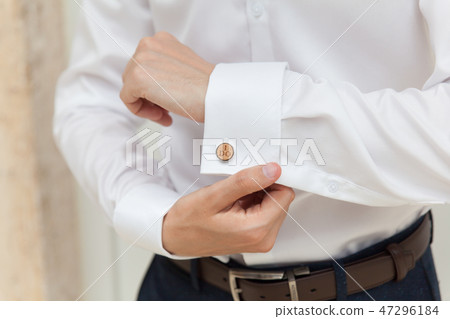 Groom prepares for wedding, shirt and cufflink Groom prepares for wedding, shirt and cufflink 47296184