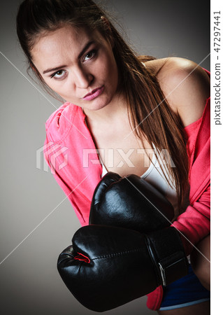 Sport boxer woman in black gloves boxing 47297441