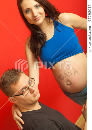 Pregnant woman belly, father drawing on it Pregnant woman belly, father drawing on it 47298015