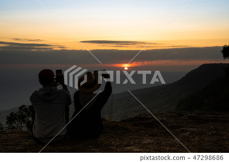A silhouette of a couple in natural surrounding 47298686